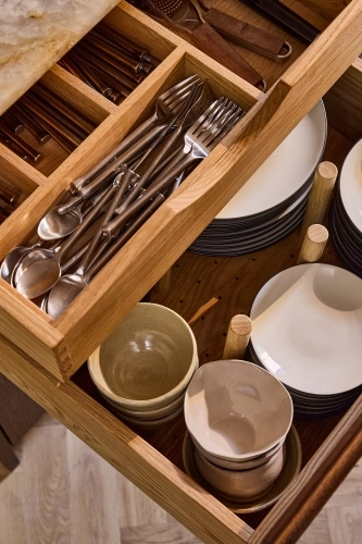 A close-up of a Internal Drawers in walnut finish.