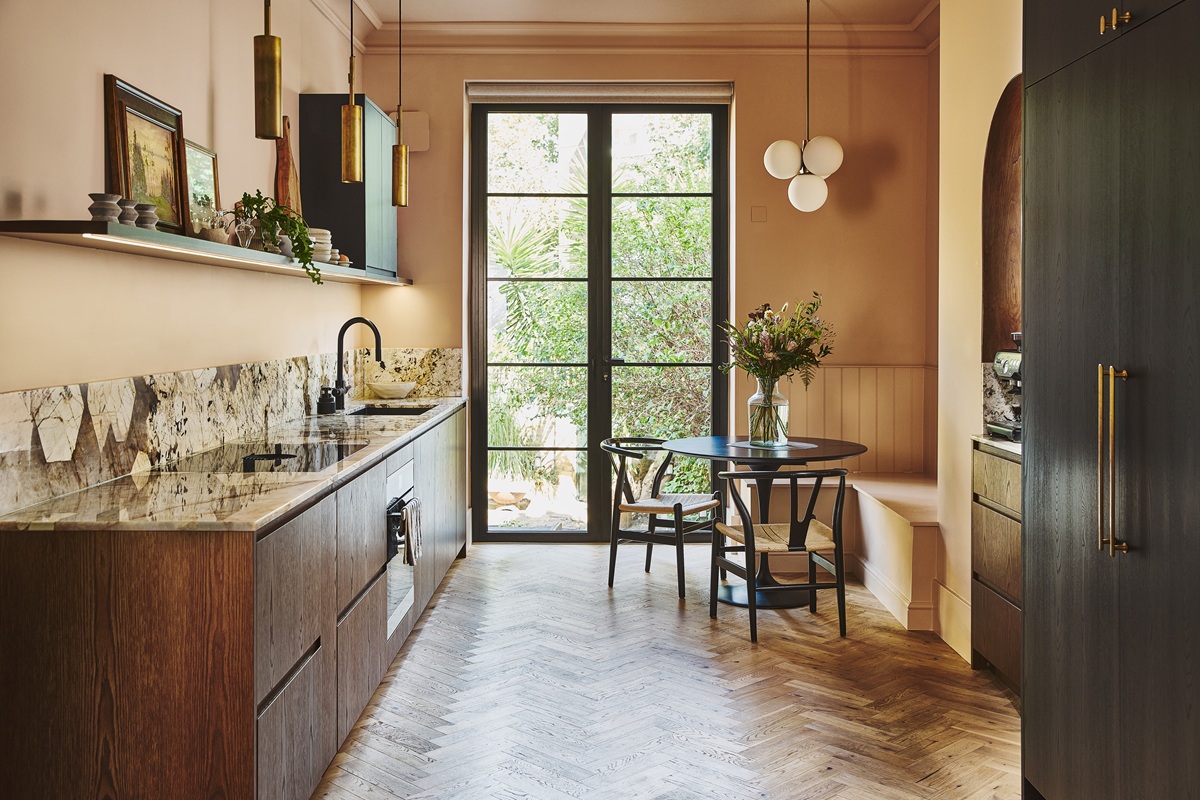 Smart Compact Spaces Shaping Kitchen Design Trends in 2026 6 Modern kitchen materials in 2026 featuring matte cabinets and natural stone countertops.